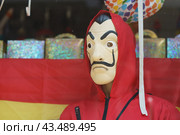 Brussels, Belgium - May 20 2018: The figure of man in the red hood. He is hero of "La casa de papel or Paper house" movie. Редакционное фото, фотограф YuryKara / Фотобанк Лори