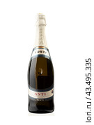 May 3, 2023, Moscow, Russia: Beautiful view of a bottle of TOSTI ASTI champagne isolated on a white background. Редакционное фото, фотограф Сергей Долгов / Фотобанк Лори