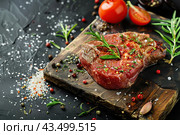 Beef raw meat, black stone background, spices, tomatoes, herbs. Top view Banner. Fresh red meat with pepper, salt for grilling on dark cutting board. Prime fillet. Food magazine style. Chief menu BBQ. Стоковое AI-изображение, AI-художник Марина Демидюк / Фотобанк Лори