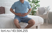 Stomach ulcer, man with abdominal pain suffering at home, symptoms of gastritis, diseases of the digestive system, health problems concept. Стоковое видео, видеограф Станислав Тарко / Фотобанк Лори