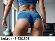 Backside close-up of woman hips woman in fit sportswear at home, domestic fitness workout. From behind of slim lady athletic glutes and legs, perfect fit. Healthy lifestyle concept. Copy ad text space. Стоковое AI-изображение, AI-художник Aleksandr Golubev / Фотобанк Лори