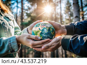 Female and male hands hold a small model of the Earth. Revival. Caring for the planet, ecological awareness and the unity of people in nature conservation. Стоковое AI-изображение, AI-художник Photojuli / Фотобанк Лори