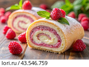 Swiss sponge roll with raspberries, a delicious fruit and cream dessert filled with cream cheese, decorated with fresh raspberries. Стоковое AI-изображение, AI-художник Photojuli / Фотобанк Лори