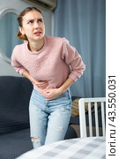 Young woman suffering from abdominal pain. Стоковое фото, фотограф Яков Филимонов / Фотобанк Лори