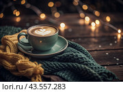 A seasonal drink. Delicious hot cappuccino in a mug with a saucer and a knitted snood, a scarf on a wooden table in the interior of the cafe. It's a rainy autumn day. Стоковое AI-изображение, AI-художник Photojuli / Фотобанк Лори