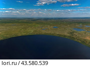 Arctic tundra in summer from an altitude of 2000 meters. Cloudy sky. Variety of colors and landscapes. The vastness of pristine nature. Shadow from the clouds. Стоковое фото, фотограф Владимир Ендовицкий / Фотобанк Лори