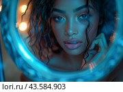 Woman Looking in Mirror With Blue Lights. Стоковое AI-изображение, AI-художник Сергей Толмачёв / Фотобанк Лори