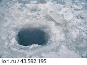 Ice hole in ice for winter fishing. Стоковое фото, фотограф Александр Прошкин / Фотобанк Лори