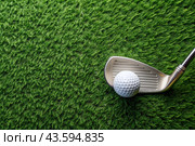A banner with a view of a green lawn, on which lies a white ball and a metal golf club. An advertisement for a golf game at a country club. Free space for text. Стоковое AI-изображение, AI-художник Photojuli / Фотобанк Лори