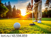The banner. A white ball and a metal golf club are lying on the lawn in the hands of a man against the sunset background. An advertisement for a golf game at a country club. Free space for text. Стоковое AI-изображение, AI-художник Photojuli / Фотобанк Лори
