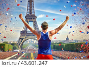 A track and field athlete won during a marathon or race against the backdrop of the Eiffel Tower at a sporting event. The concept of the Summer Olympic Games. Стоковое AI-изображение, AI-художник Photojuli / Фотобанк Лори