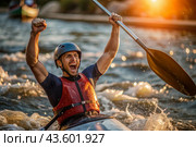 A kayaker celebrates his victory with an oar in his hands on a blurred background of the river. Kayaker at the Summer Olympics. Стоковое AI-изображение, AI-художник Photojuli / Фотобанк Лори