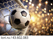 Goal. A soccer ball in the goal net, against a background of sparkling lights and a blurred background. Стоковое AI-изображение, AI-художник Photojuli / Фотобанк Лори