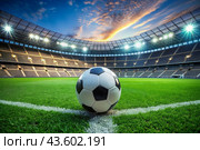 Soccer ball on the green field in soccer stadium. ready for game in the midfield. Стоковое AI-изображение, AI-художник Photojuli / Фотобанк Лори