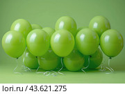A Bunch of Green Balloons Floating in the Air. Стоковое AI-изображение, AI-художник Юлия Гапеенко / Фотобанк Лори