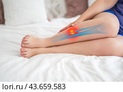Fibula fracture, broken leg, woman suffering from pain, accident at home. Стоковое фото, фотограф Станислав Тарко / Фотобанк Лори