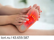 Joint diseases, hallux valgus, plantar fasciitis, heel spur, woman's leg hurts, pain in the foot, female feet closeup. Стоковое фото, фотограф Станислав Тарко / Фотобанк Лори