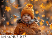 Little boy having fun during stroll in the forest at sunny autumn day. Child playing maple leaves. Baby tossing the leaves up. Active family time on nature. Hiking with little kids. Dry leaves rustle. Стоковое AI-изображение, AI-художник Ирина Михайличенко / Фотобанк Лори