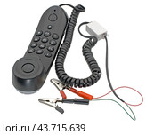 Телефонная трубка с зажимами на белом фоне. Telephone handset with clips on white background. Стоковое фото, фотограф Татьяна Д / Фотобанк Лори