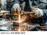 Work at the factory. Working professions. Men's hands in protective gloves with metal. There are sparks around. Hard work that requires high concentration and professionalism. Стоковое AI-изображение, AI-художник Photojuli / Фотобанк Лори