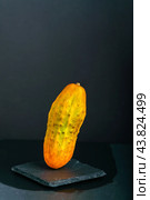 Overripe yellow cucumber on dark background. Стоковое фото, фотограф Татьяна Степанищева / Фотобанк Лори