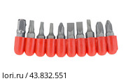 Набор сменных насадок, бит, для отверток на белом фоне. A variety of replaceable nozzles for screwdriver bits on a white background. Стоковое фото, фотограф Татьяна Д / Фотобанк Лори