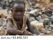 Solemn child in stony surroundings. Стоковое AI-изображение, AI-художник Иван Рябоконь / Фотобанк Лори