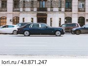 Dark blue business class sedan Rolls-Royce Phantom VIII Series II is driving fast on the highway, motion blur background. Редакционное фото, фотограф Константин Григорьев / Фотобанк Лори