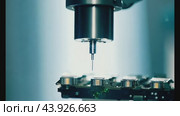 Robotic precision drilling on circuit board in advanced factory. Стоковое видео, видеограф Данил Руденко / Фотобанк Лори