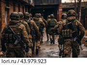 War. Military actions. Soldiers of the elite anti-terrorist unit of the army among the broken buildings. Clearing the territory from the enemy. Стоковое AI-изображение, AI-художник Photojuli / Фотобанк Лори