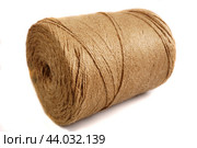 A large skein of strong, harsh threads for filing documents lies at an angle on a white background in isolation. Стоковое фото, фотограф Ярославский Максим / Фотобанк Лори