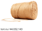 A large skein of strong, harsh threads for filing documents lies at an angle on a white background in isolation. Bottom view. Стоковое фото, фотограф Ярославский Максим / Фотобанк Лори