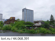 "Курган город контрастов". Жилой комплекс "Династия" и частный сектор (2024 год). Стоковое фото, фотограф Алексей Иванов / Фотобанк Лори