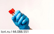 Two test tubes with a blood test in the doctor's hand. A blood test to determine the monkey pox virus. The concept of the smallpox pandemic and viral infection. Стоковая иллюстрация, иллюстратор Скрипачев Антон / Фотобанк Лори