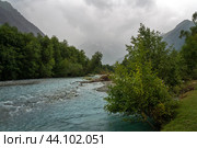View of the Psysh River and the Amanauz-Bashi Mountain of the Northern Caucasus Mountains near the village of Arkhyz on a sunny summer day, Karachay-Cherkessia, Russia. Стоковое фото, фотограф Ula Ulachka / Фотобанк Лори