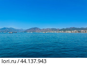 Mugla, Marmaris, Turkey - July 09, 2024: Island view on the Mediterranean coast of Turkey. Mediterranean beach during summer vacation. A warm holiday island in the Aegean Sea. Редакционное фото, фотограф Григорий Стоякин / Фотобанк Лори
