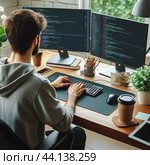 Программист за работой A young man in a suit is working on a laptop in an office with digital codes on a virtual screen. Digital technologies of the future. Software development. Стоковое AI-изображение, AI-художник Ефимчик Елена Николаевна / Фотобанк Лори