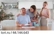 Upset family with documents having financial problems. Стоковое видео, видеограф Яков Филимонов / Фотобанк Лори