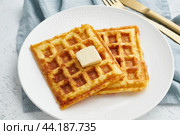 Chaffle, ketogenic diet health food. Homemade keto waffles with egg, mozzarella cheese. Стоковое фото, фотограф Natalia Gdovskaia / Фотобанк Лори