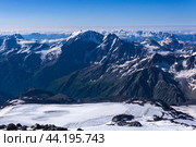 Top view of the high mountains above the clouds from the slope of Mount Elbrus. Стоковое фото, фотограф Евгений Харитонов / Фотобанк Лори