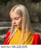 Portrait of a girl in a yellow shirt and a red sweater. Стоковое фото, фотограф Владимир Ушаров / Фотобанк Лори