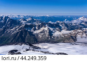 Top view of the high mountains above the clouds from the slope of Mount Elbrus. Стоковое фото, фотограф Евгений Харитонов / Фотобанк Лори