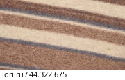 Soft Knitted Woolen Detailed Texture. Natural Fabric Closeup Knit Pattern. Striped Knitwear, Warm Cashmere Surface. Rotation, Macro. Cozy Textile Background. Clothes Production. Melange Yarn. 4K Shot. Стоковое видео, видеограф Марина Демидюк / Фотобанк Лори