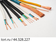 Various Electrical Wires With Exposed Copper Strands on White Background. Стоковое фото, фотограф Сергей Толмачёв / Фотобанк Лори