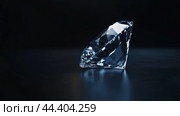 Diamond on reflective dark surface background. Стоковое AI-изображение, AI-художник Анастасия Золотницкая / Фотобанк Лори