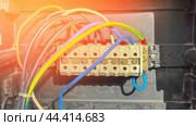 A bunch of wires are connected to a box with a green and blue wire. Стоковое фото, фотограф Скрипачев Антон / Фотобанк Лори