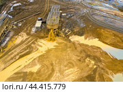 Gold mining. Flushing the rock with an old dredge. Environmental pollution. Стоковое фото, фотограф Евгений Ткачёв / Фотобанк Лори
