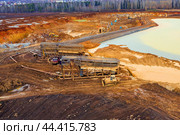 Gold mining. Flushing the rock with an old dredge. Environmental pollution. Стоковое фото, фотограф Евгений Ткачёв / Фотобанк Лори