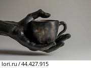Black hand holding coffee cup. Generate ai. Стоковое AI-изображение, AI-художник Иван Рябоконь / Фотобанк Лори