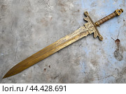 Venerable Ancient relic sword gold. Generate Ai. Стоковое AI-изображение, AI-художник Иван Рябоконь / Фотобанк Лори